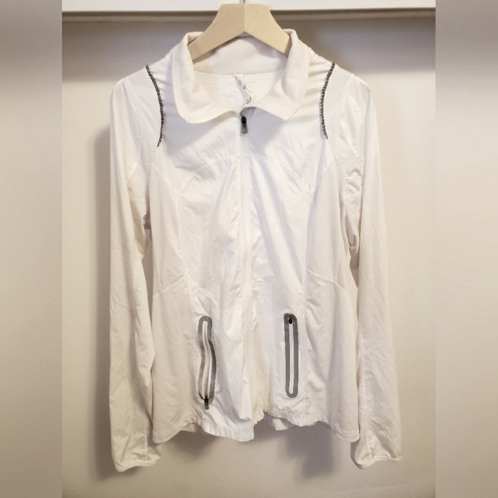 Lululemon light jacket. White. Silver reflective parts. Size 12. Full Zip.